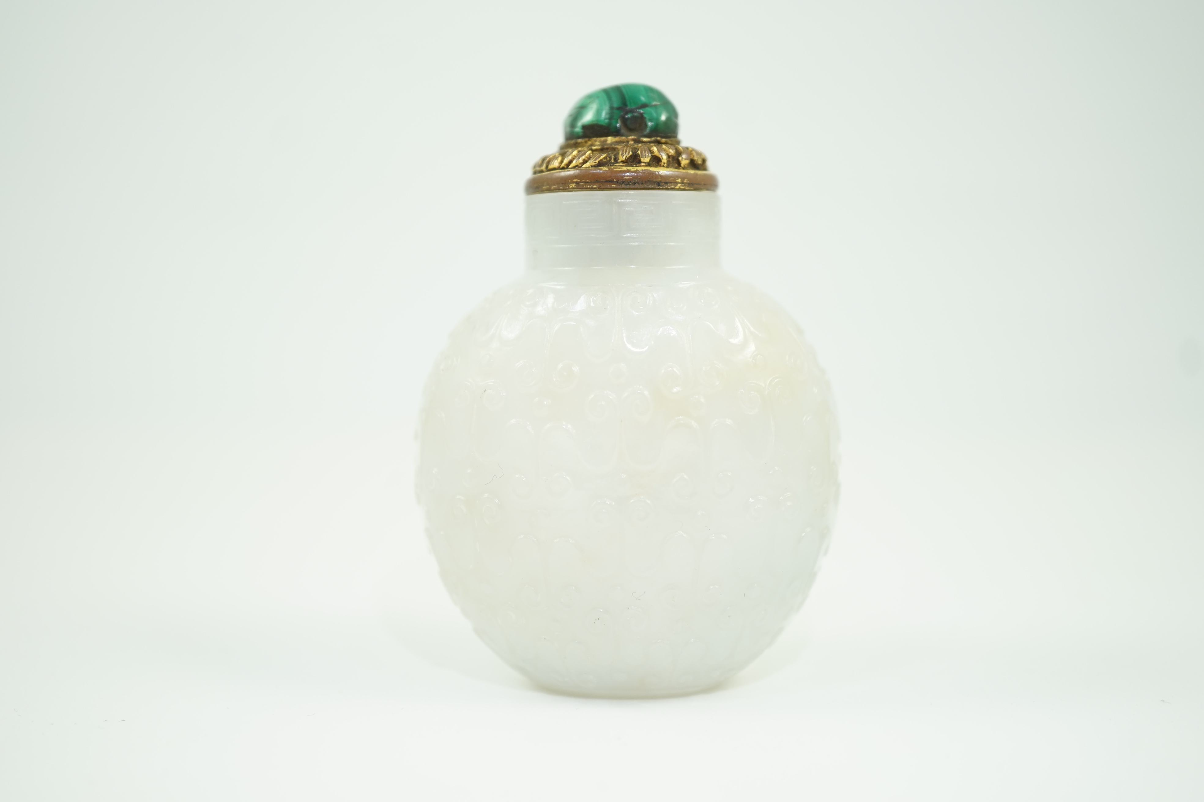 A good Chinese archaistic white jade snuff bottle, 1780-1850